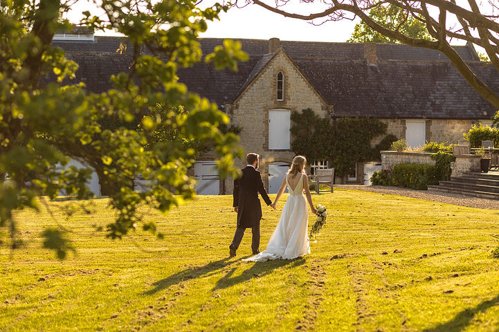 Bride and groom in golden hour at Longbourn Estate Barn Wedding