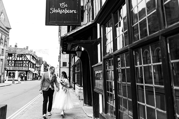 Couple walking along the streets of Stratford-upon-Avon