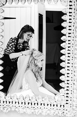 Bride has her veil put in