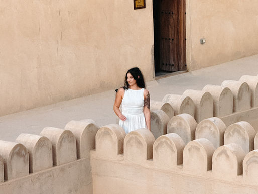 Woman in linen dress in Nizwa Oman