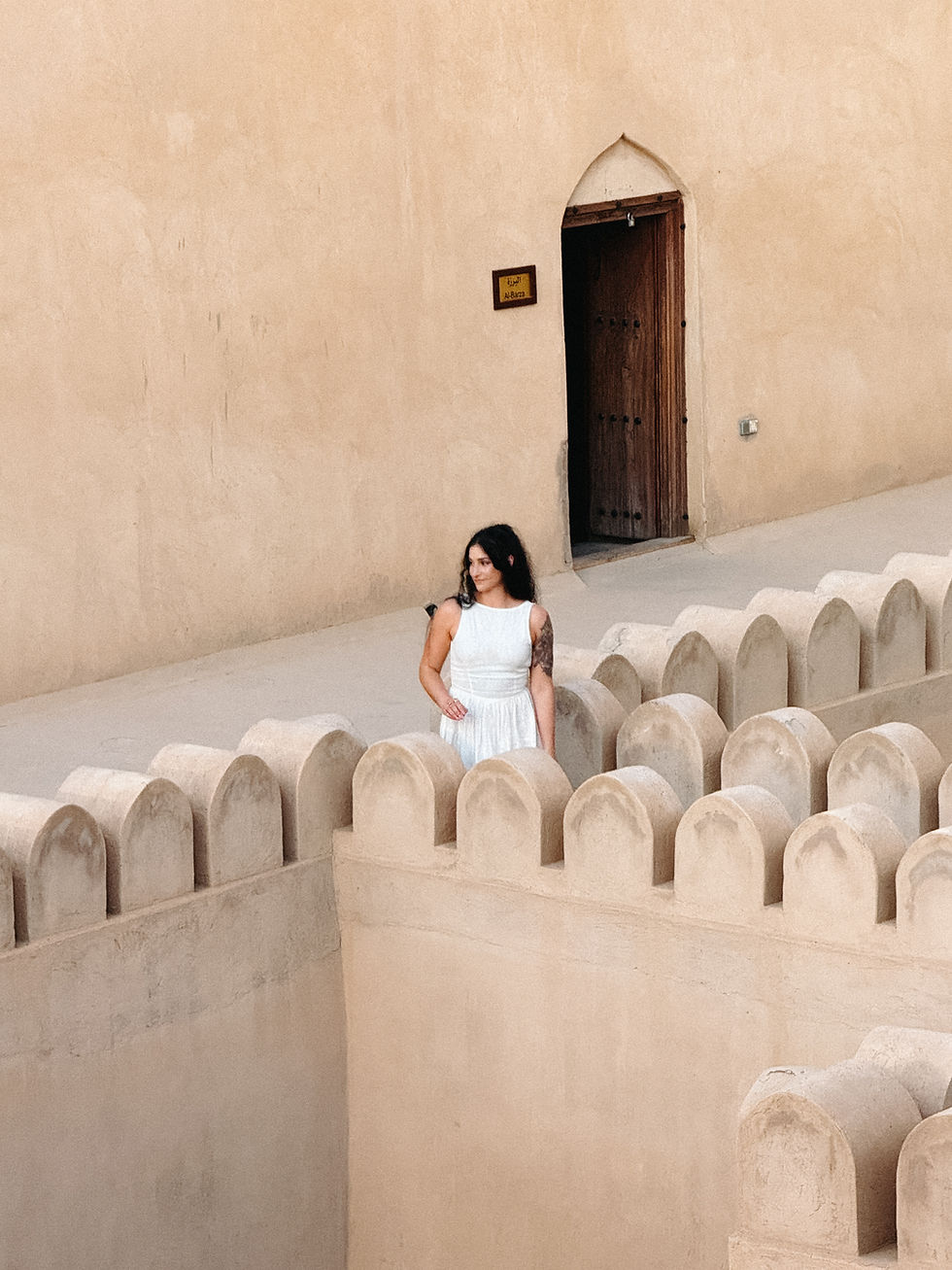 Woman in linen dress in Nizwa Oman
