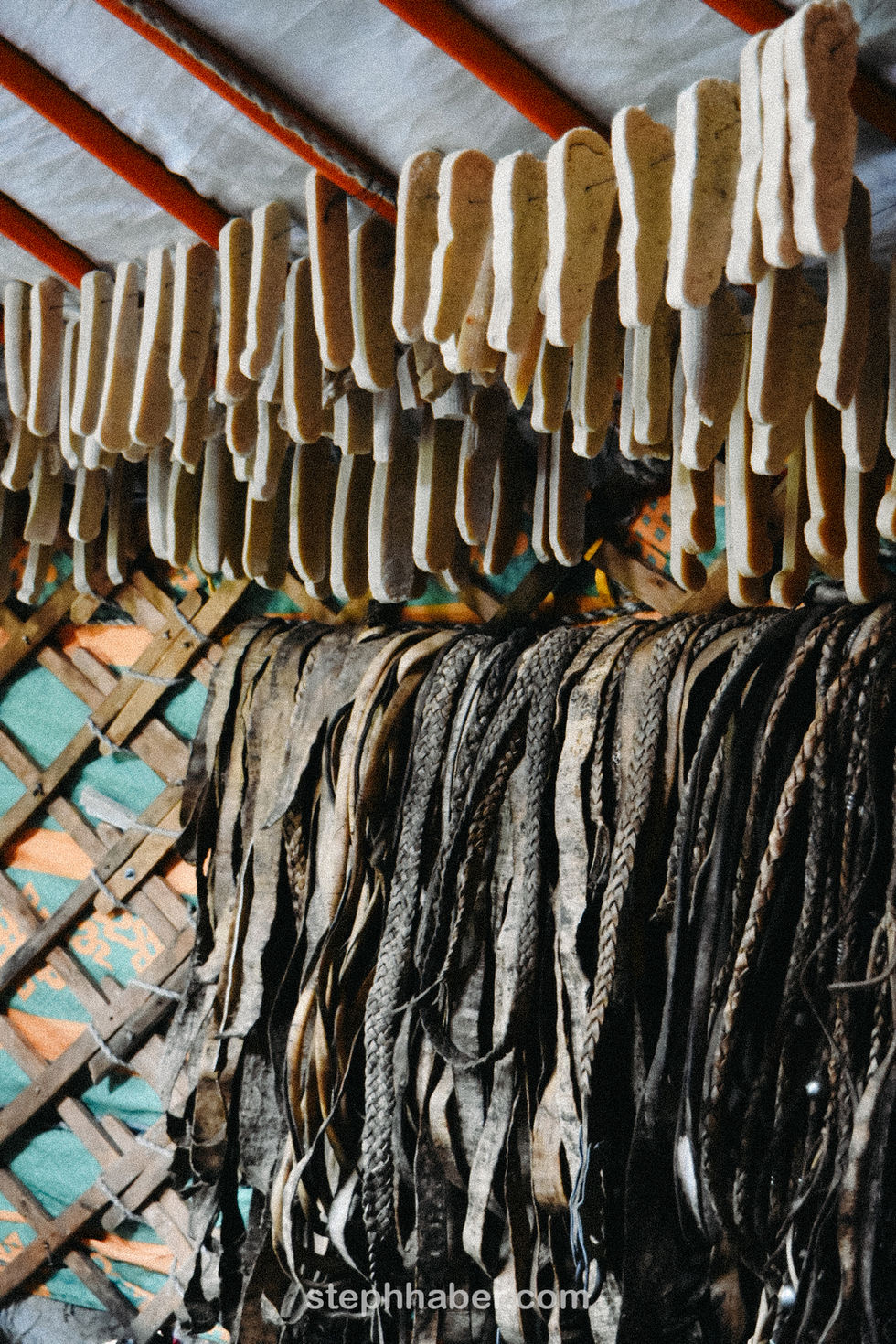 Hanging fish drying in a traditional setting.
