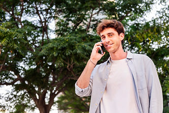 smiling-man-talking-on-mobile-phone-while-walking-2025-04-13-01-32-20-utc.jpg
