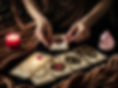 A dark and elegant tarot reading scene focused on emotions and love. A soft brown velvet c