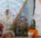 A close up photo of the right side of the altar, with the butterfly statue and prompt that asks "what are you transforming into?"