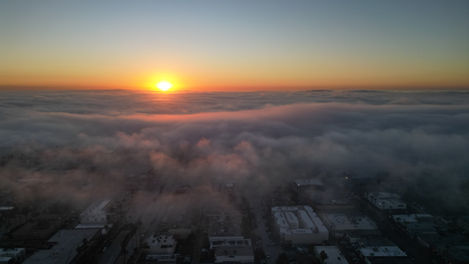 Drone photography of Fog bank rolling in over Sunset at Downtown San Diego, CA