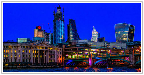 Stylised blue hour look of The City from the Thames