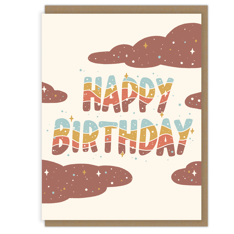 Happy Birthday greeting card featuring retro rainbow-style lettering with playful clouds and star accents in a warm, vintage-