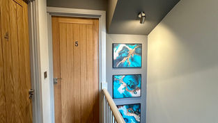 Close-up of a student viewing a virtual property walkthrough tour of a luxury student house in Loughborough on a mobile phone.