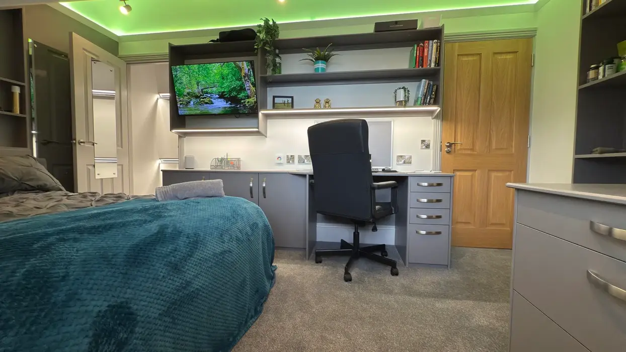 Modern student room at 11a Park Road featuring ambient lighting and minimalist décor.