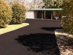 Freshly laid black asphalt residential driveway on the Sunshine Coast