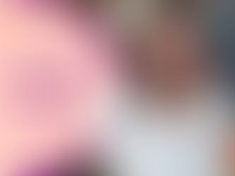 Text reads: Editing your first draft. Jerrica hands a red pen forward while smiling with a book shelf in the background.