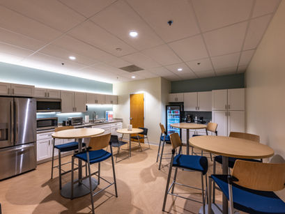 Corporate breakroom and kitchenette build-out with stainless steel appliances.