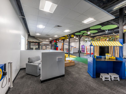 Integrated design-build features for an interactive children's educational facility.
