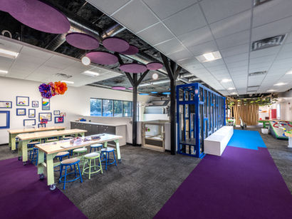 Art and activity room construction with custom lighting and durable flooring.