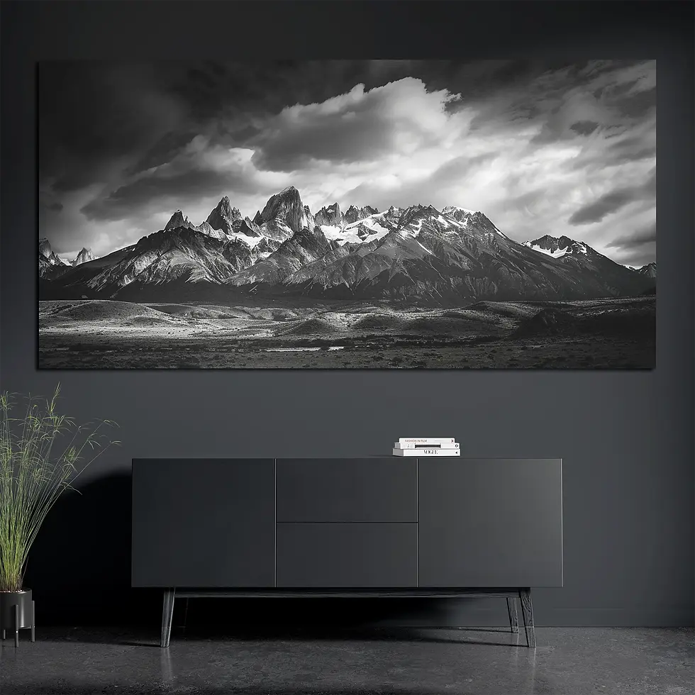 Brushed aluminum mountain panorama metal wall art above console with books and plant