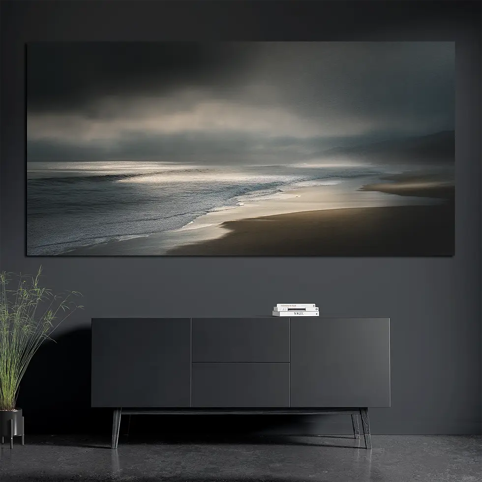 Brushed aluminum metal wall art featuring moody ocean shoreline above console with books and plant