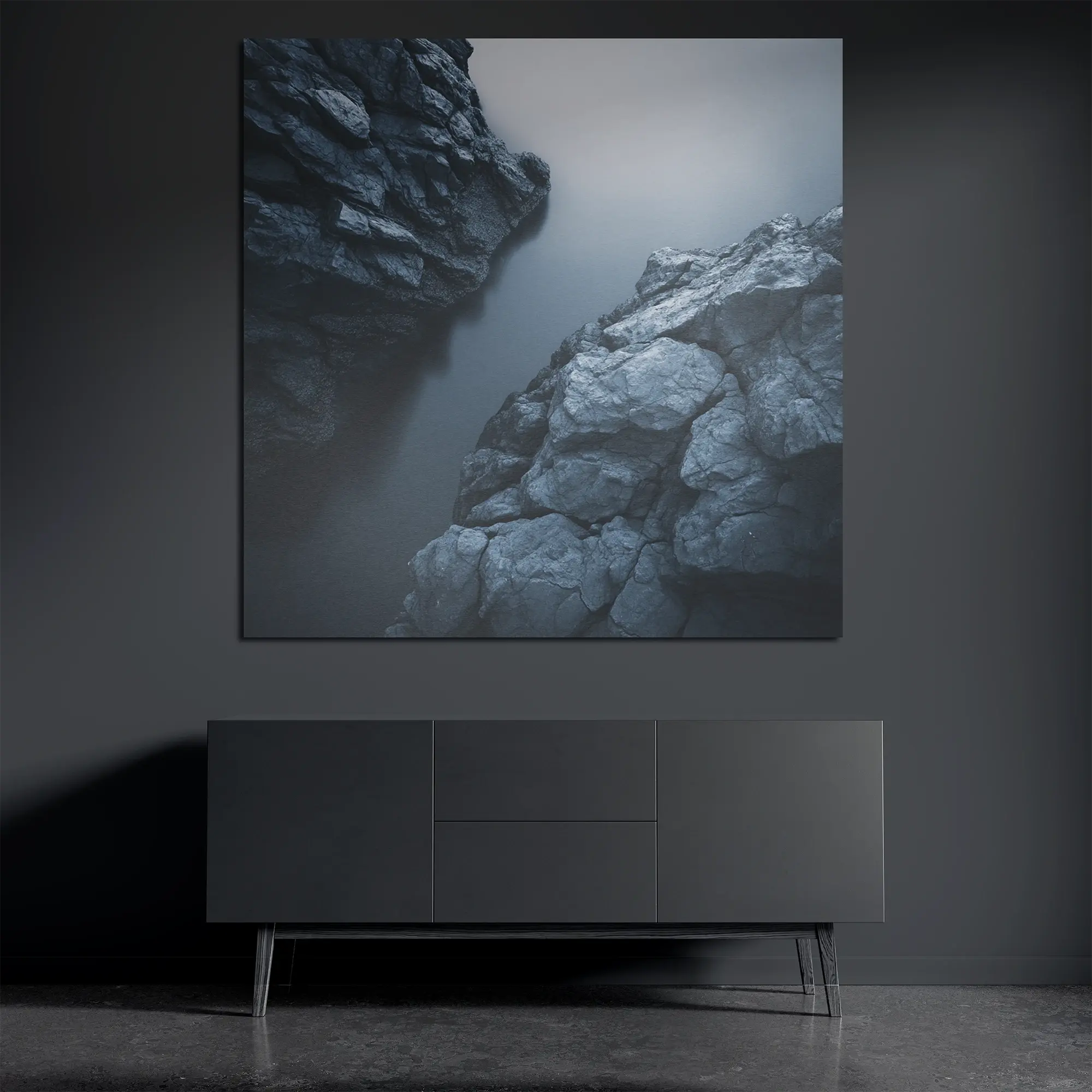 Minimal rock and water metal wall art on brushed aluminum above dark console