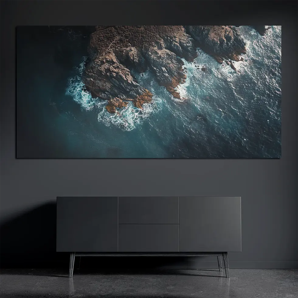 Aerial rocky coastline metal wall art on brushed aluminum above dark console