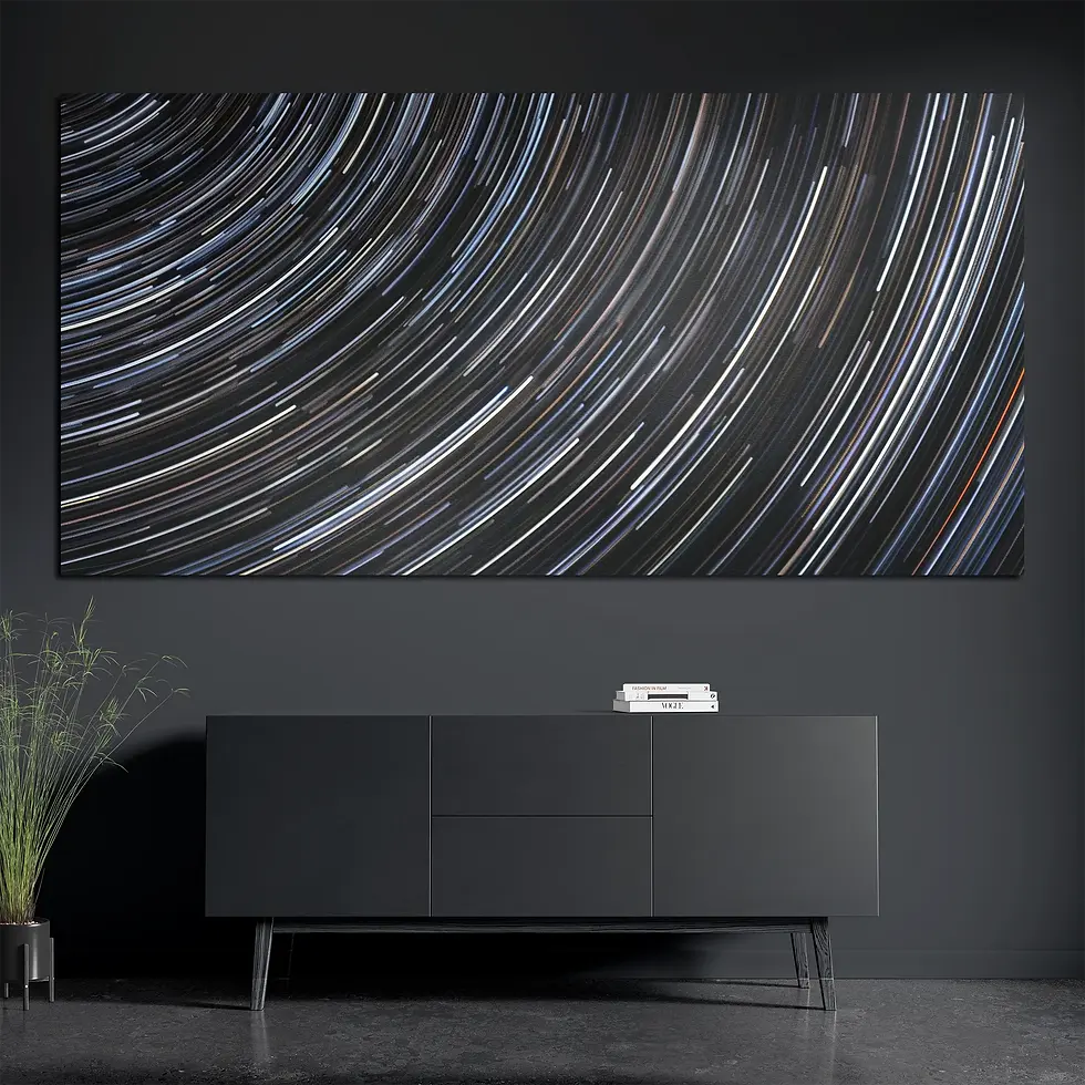 Panoramic night sky print styled with books and plant