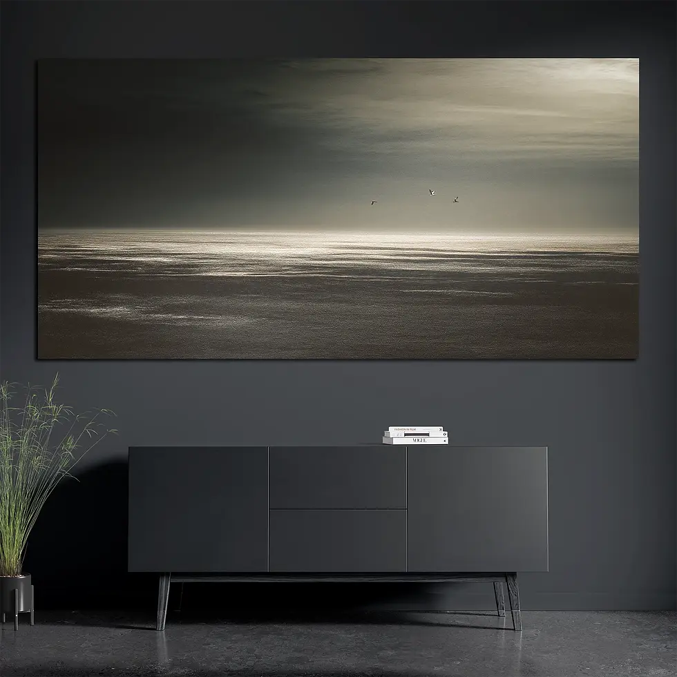 Brushed aluminum ocean horizon metal wall art with birds above console with books and plant
