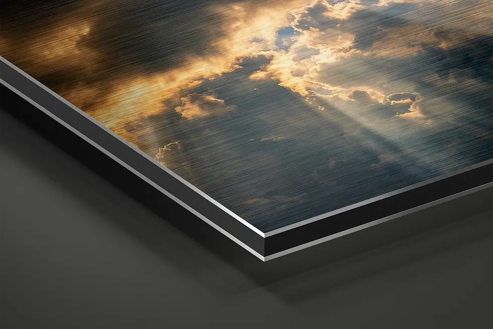 Thumbnail: Close-up of brushed aluminum surface with golden sunbeam cloud detail