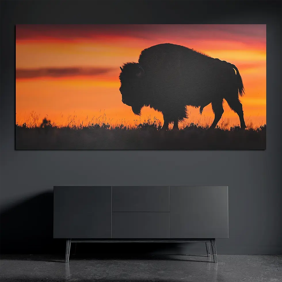 Sunset bison metal wall art on brushed aluminum above dark console