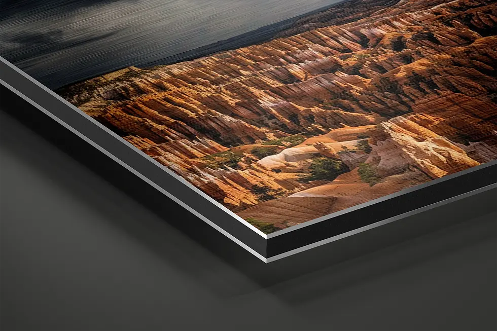 Thumbnail: Close-up of brushed aluminum metal print showing layered canyon rock texture and depth