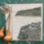 Thumbnail: Lino carving tools and block in progress – Robin Hood’s Bay III linocut print studio process