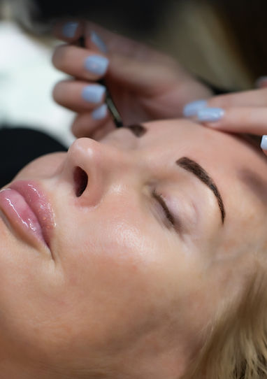 Brow tint being applied at Lash and Brow Design Co. in Carmel, creating natural, defined, and polished brows by expert artist