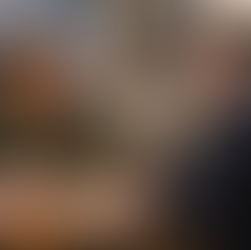 Student advisor speaking with teacher during an Irish parent–teacher meeting on behalf of overseas parents