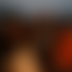 International high school students celebrating Halloween in Ireland around a bonfire, smiling in costumes in a small Irish village.