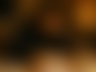 Student studying at host family kitchen table in Ireland with notes and planner.