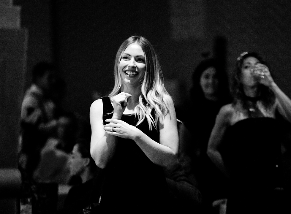 a lady smiling at an event