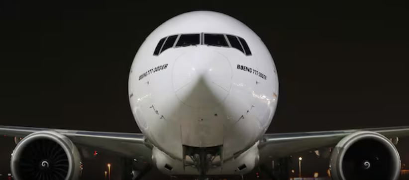 and image of the front of a white airplane