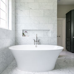 Marble Tile Walls, Elegant, seamless, white, Freestanding Bathtub, Modern, sleek, center, Glass Block Window, Light-filled, privacy, frosted, Recessed Wall Niche, Practical, storage, decorative, Wall-mounted Faucet, Polished, chrome, dual-handle, Large Vanity Mirror, Reflective, framed, square, Double Vanity Cabinets, Spacious, dark, wood, Marble Floor Tiles, Smooth, polished, matching, Overhead Lighting, Subtle, bright, recessed, Vanity Sink Countertops, Durable, solid, marble, Elegant Wall Sconce, Stylish, metal, double, Cabinet Door Handles, Chrome, sleek, horizontal, Vanity Drawers, Functional, deep, ample, Framed Mirror Edge, Wood, dark, clean, Inset Door Panels, Classic, detailed, wood, Shower Control Valve, Concealed, easy-use, chrome, Door Frame Trim, Smooth, white, finished, Towel Rings, Simple, round, metallic, High Ceiling Space, Expansive, open, airy, Subtle Wall Color, Neutral, warm, complementing,