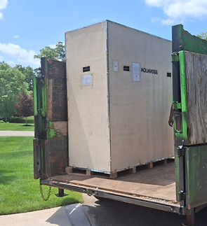 "Professional disposal of an old hot tub by the Affordable Moving Kalamazoo team for backyard reclamation."