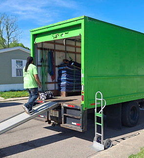 "Affordable Moving Kalamazoo green moving truck parked during a local residential move