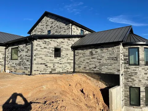 Black Horse stone on a large house by Rock-It Natural Stone