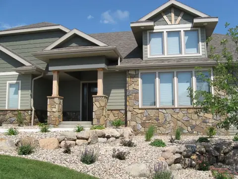 Blue Brown Honeycomb stone on the outside of a house by Rock-It Natural Stone