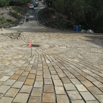 Pavers mined and cut by Rock-It Natural Stone to form a stunning driveway roundabout.
