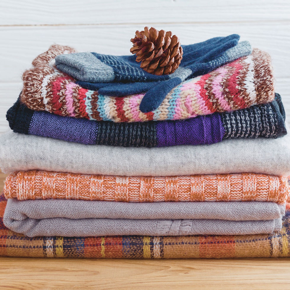 A stack of knitted blankets