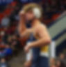 wrestler with fist in the air after a win