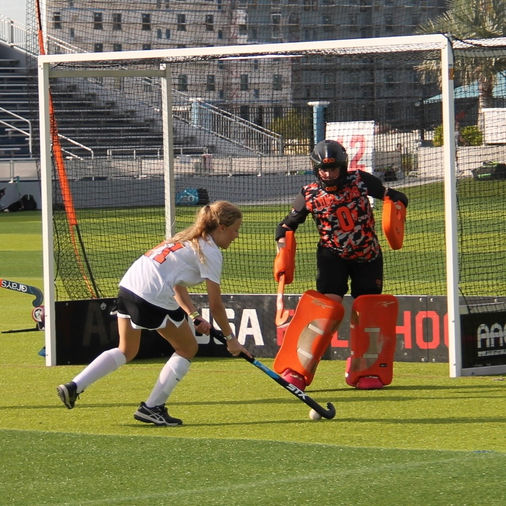 Youth atlanta field hockey player playing in a field hockey game