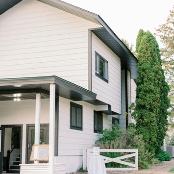 White building surrounded by trees