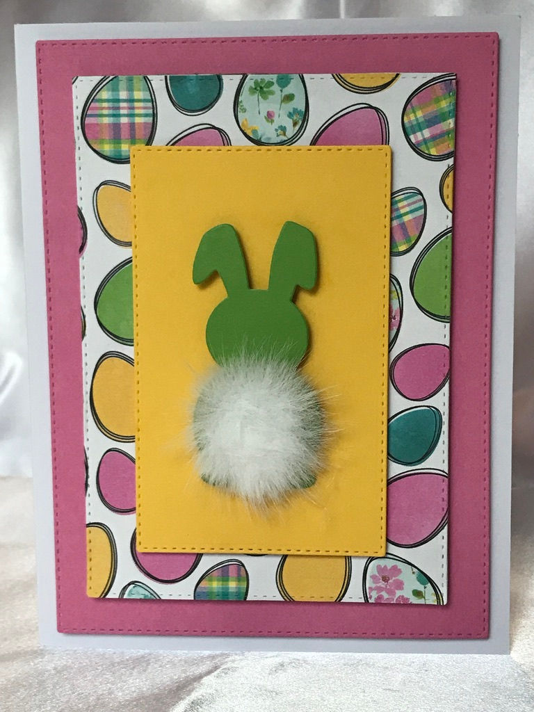 Handmade Easter greeting card with green bunny and cotton tail.