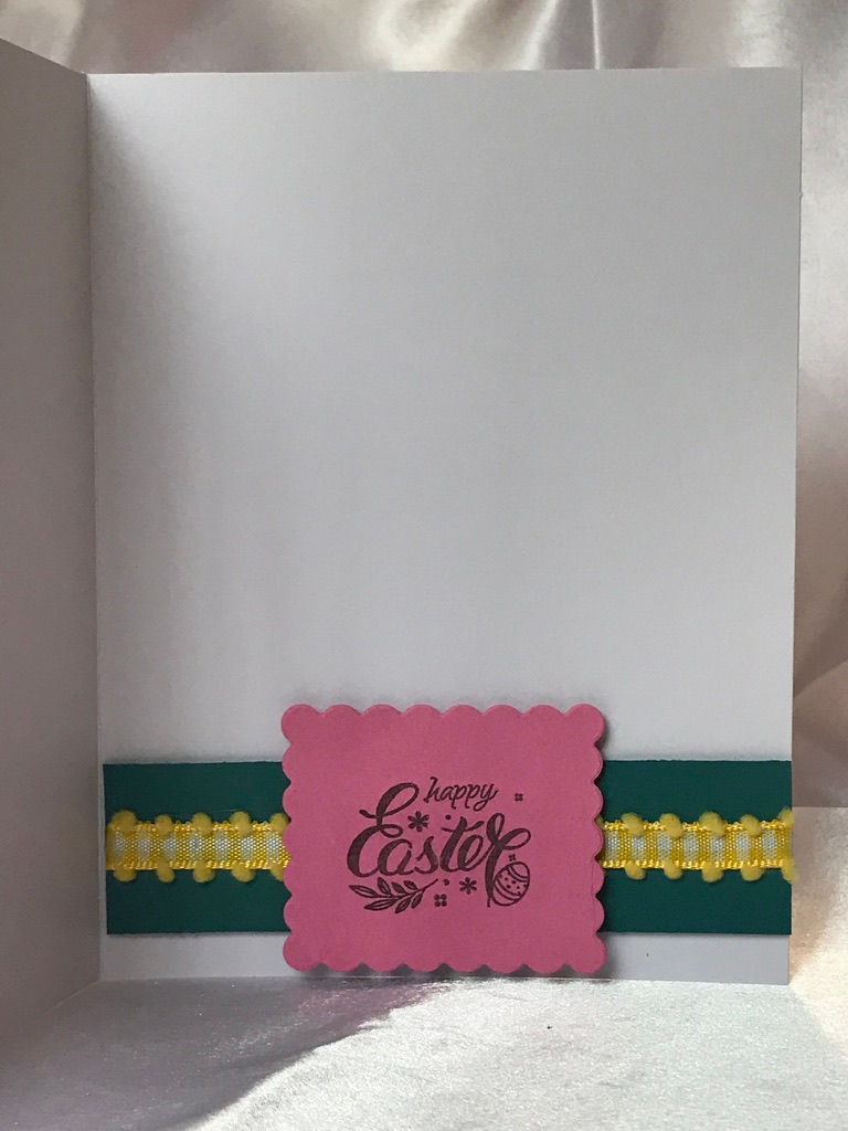 Thumbnail: Pink and yellow paper with an egg print in pink, green, orange, yellow, teal, and blue.  On top a green bunny with a fluffy bunny butt.