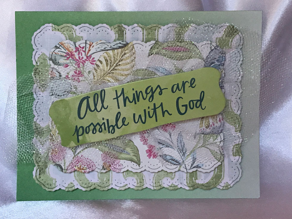 Handmade christian greeting card with uplifting message and green floral background.