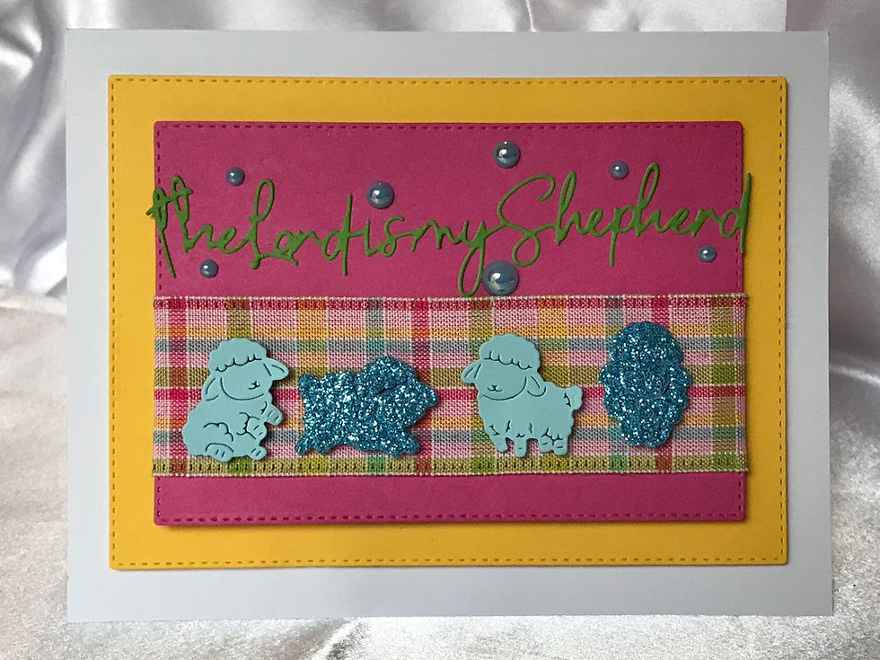 Pink with bright yellow stitched die cuts.  Pink, yellow, green, and blue ribbon border, with little blue sheep.  "The Lord is My Shepard." Psalm 23 is in green cursive writting, with blue gem embellishments.