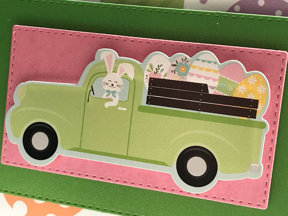 Awesome vintage green truck with a load of colorful eggs and a bunny driver is at the center of this card.  Underneath several layers of green, pink, and egg printed card stock.  The bottom has a bright green glittery ribbon with five wooden buttons.